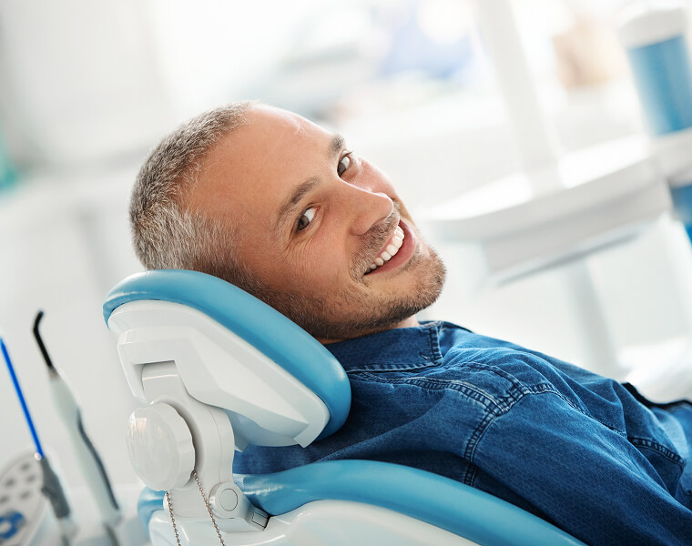 smiling man at the dentist