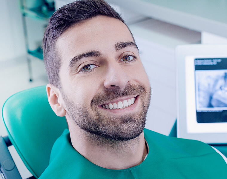smiling man at the dentist