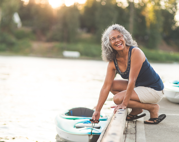 senior woman with a kayak